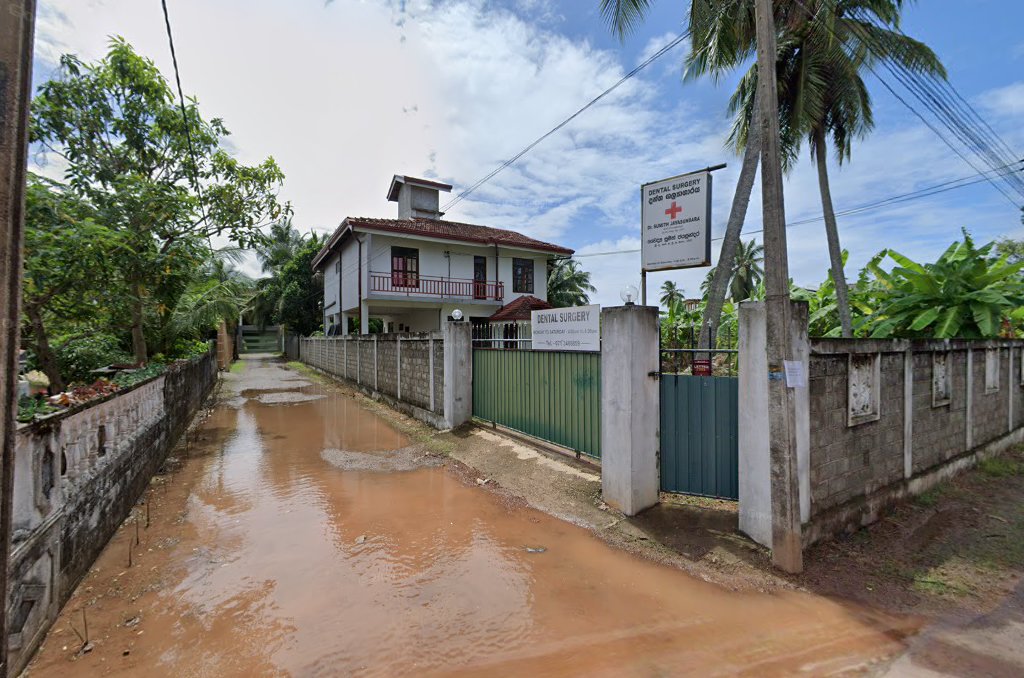 Street view of the dental surgery entrance and roadside sign in Negombo